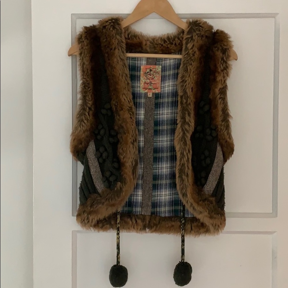 Faux fur vest with wool detail and pompoms